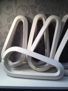 Porcelain lighting 'hooks' for a restaurant. Model, ,aster mould and fired pieces.