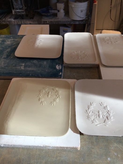 9"x9" and 11.5" x 6.25" platters in white, pale blue or pale yellow glaze...drying in the studio.